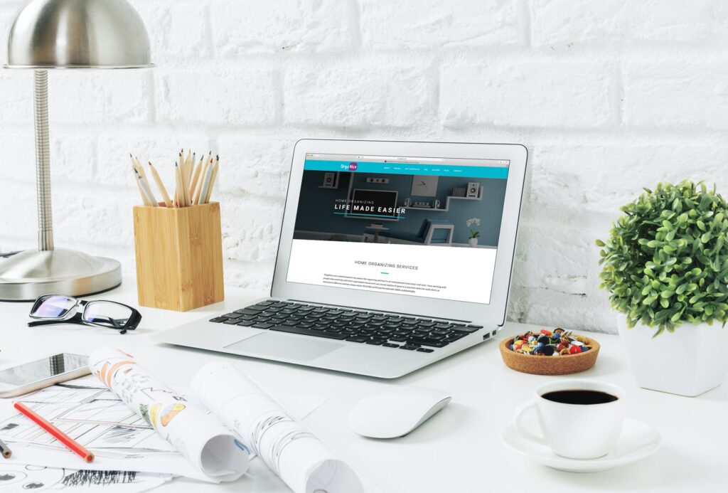 Laptop on a desk showing a website